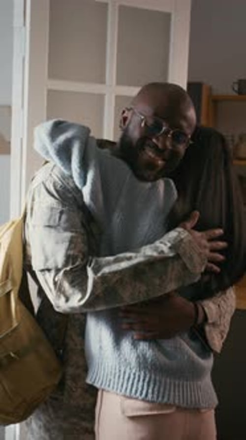 Soldier Returns Home, Embracing Loved One