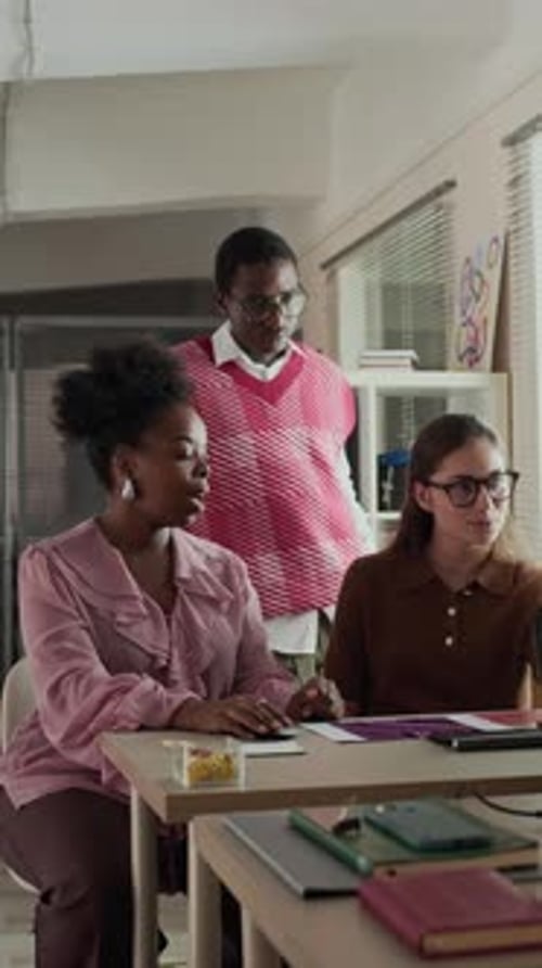 Diverse Creative Team Discussing Insights while Collaborating in Office