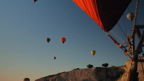 Hot Air Balloons Rise Over Cappadocia at Sunrise