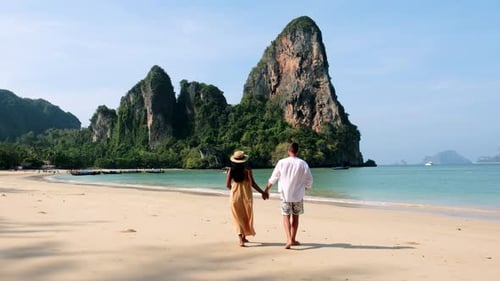 Strolling Hand in Hand on the Pristine Sands of Railay Beach in Krabi Thailand