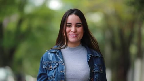 Surprised Woman Reacting to News in Outdoor Setting