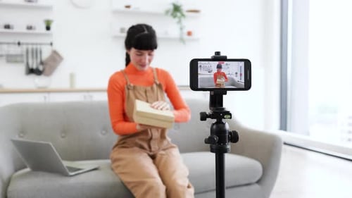 Woman Unboxing New Cell Phone for Social Media