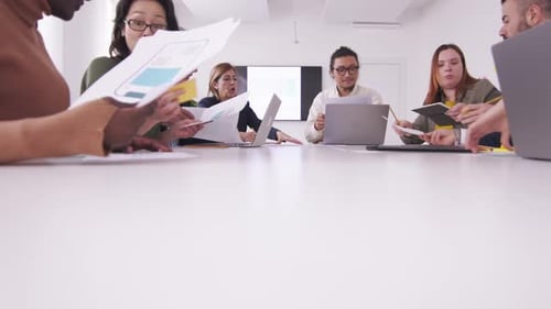 diverse teamwork in modern business office in a meeting discussing document and planning strategy