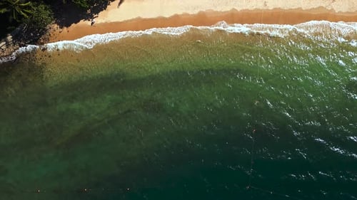 Beautiful turquoise seascape on sunny day from birds eye view.