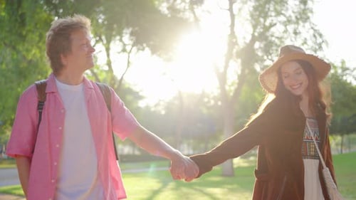 A Romantic Stroll Through the Park Celebrating a Couples Joyful and Loving Bond Together