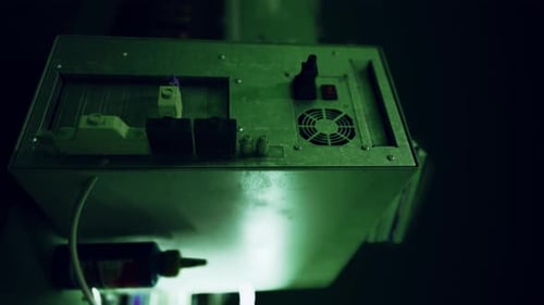 Futuristic Industrial Machine with Pulsating Green Light