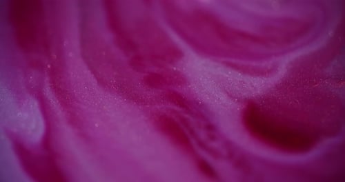 Abstract Pink Sparkling Liquid Swirling Close Up