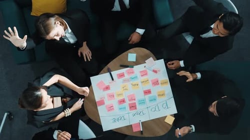 Brainstorming Business Team Puts Hands Together in Meeting