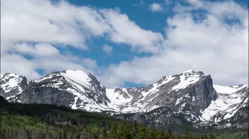 4K clouds passing over a mountain time lapse