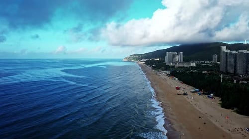 Aerial Top view of a transparent blue sea with beautiful waves at sunny day in summer. air of ocean