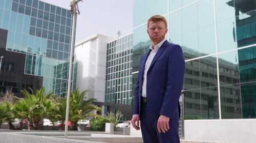 Businessman Posing Outside Office Building