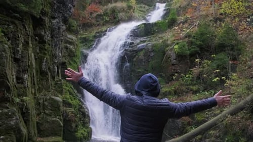 Male Tourist a Sense of Freedom in Nature Mountain Waterfall