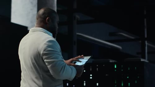 Software Developer in Data Center Using Tablet Employing Machine Learning