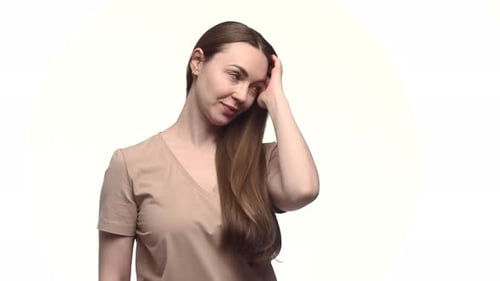 Woman With Long Hair Runs Hand Through Hair