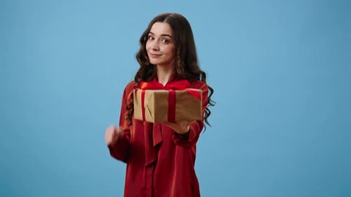 Woman Presents a Birthday Gift with Enthusiasm