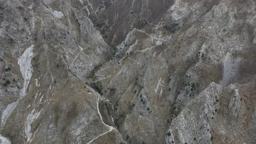 Aerial view of winding roads on mountains, Italy.