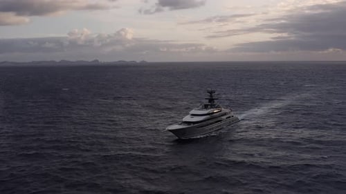 Luxury Yacht at coast of Madeira sunset aerial view