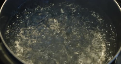 Boiling Water Bubbling in a Cooking Pot