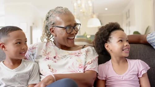 Loving Family Sharing Joyful Moments on Couch