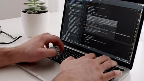 Coding on the Screen HTML Encoding and Programming on a Laptop Screen Developer Web Development