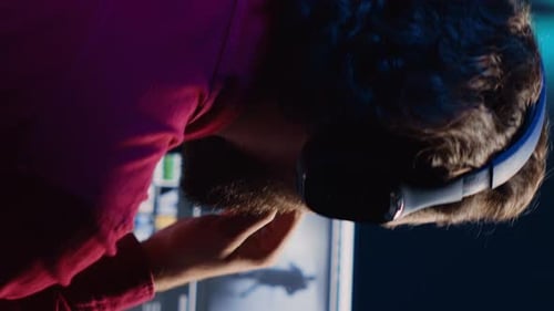 Vertical Video Post Production Studio Employee Working with Raw Footage While Listening Music in