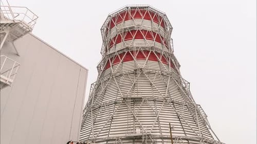 Time Lapse Motion Past Huge Cooling Tower Against Sky