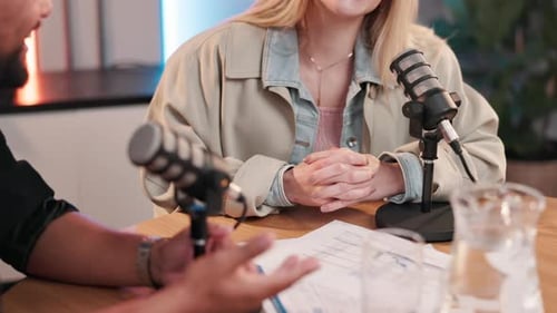 Podcast, presenter and people with microphone for conversation, broadcast and talking for interview