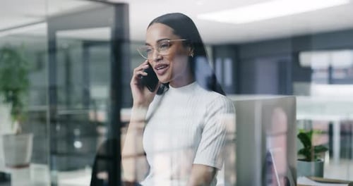 4k video footage of a young businesswoman using a smartphone in a modern office