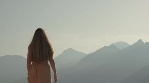 Woman Staring at Beautiful Mountain Landscape