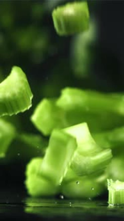 Pieces of Chopped Celery Fall on the Table Filmed on a Highspeed Camera at 1000 Fps