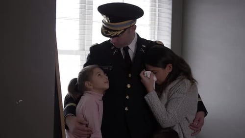 Soldier Hugging Crying Wife and Child in Home