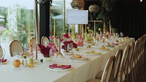 Long Dining Table Set with Candles and Flowers