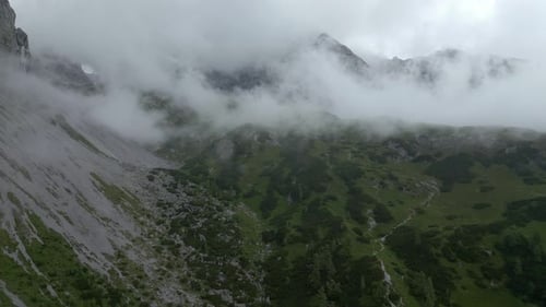 Aerial view of a mountain range covered in clouds, Austria.