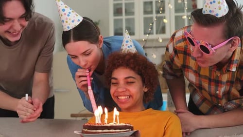Friends Celebrate Birthday Together with Cake Indoors
