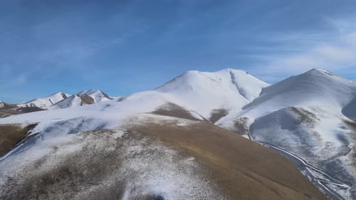 Majestic Snowy Mountain Range Aerial View