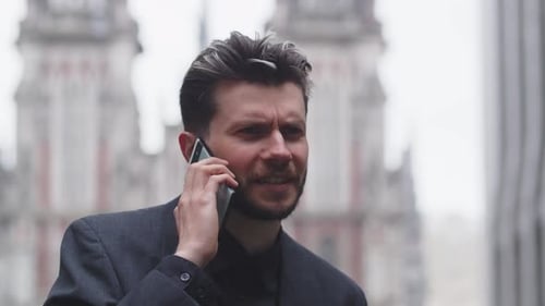 Man Talking on Smartphone in the City