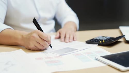 Closeup, Businessman signing a contract investment professional document agreement on the table