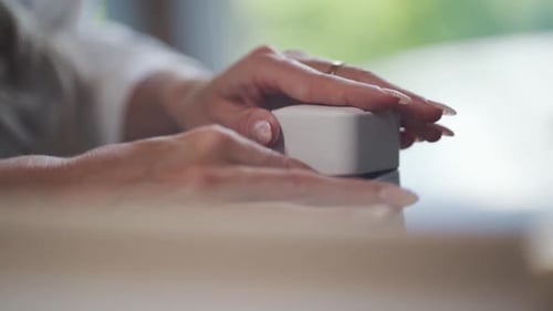 Woman Opens Ring Box Showing Engagement Ring