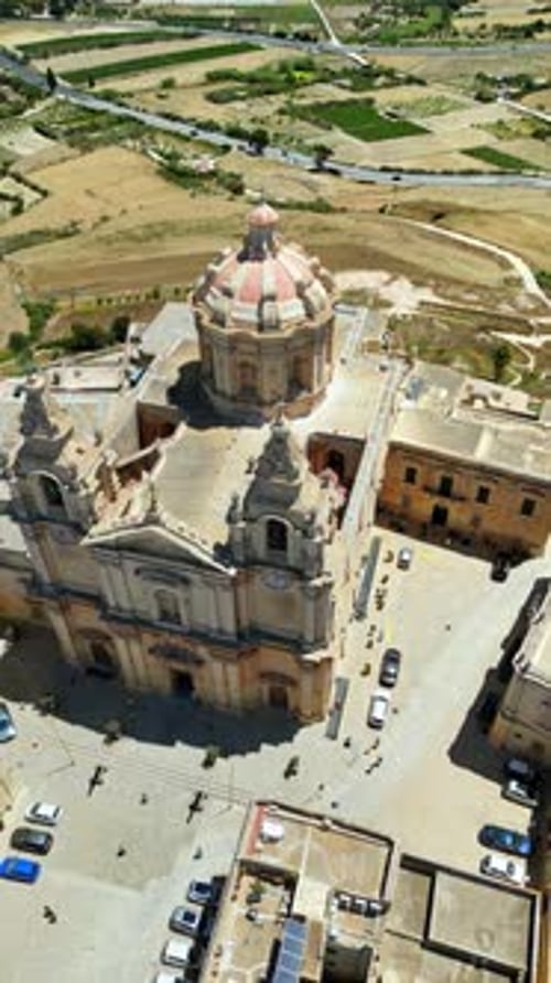 Aerial drone view of The Metropolitan Cathedral of Saint Paul in Mdina, Malta. Vertical