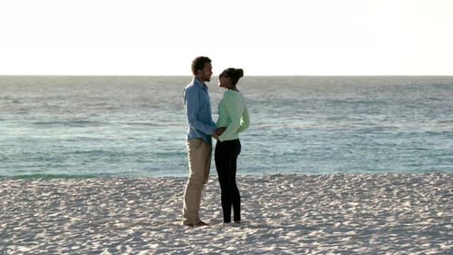 Kiss, travel and love with black couple at beach for romance, summer break or date