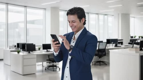 Happy Indian manager using mobile phone