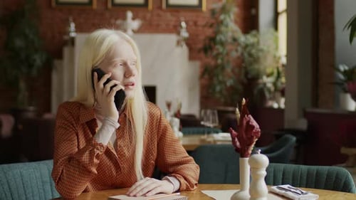 Gen Z Girl With Albinism Chatting On Phone