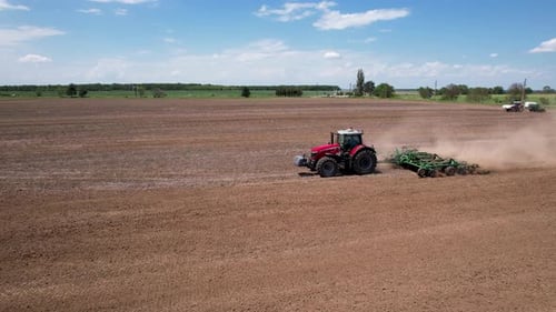 Aerial view of a tractor tilling a field, Bulgaria.