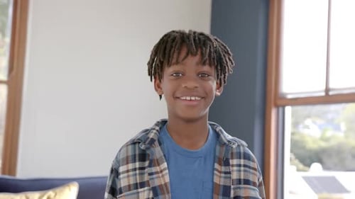 Smiling Boy in Blue Shirt Posing Indoors