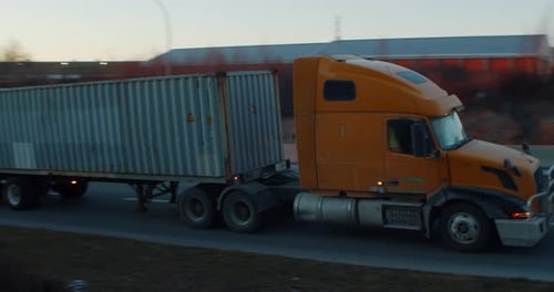 Long Distance Semi Trailer Truck with Cargo Trailer Driving on the Highway