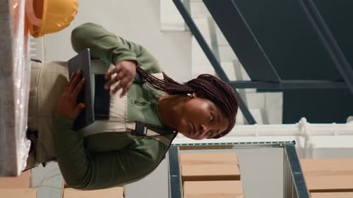 Vertical Video Warehouse Employee Managing Inventory