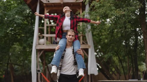 A Joyful Outdoor Moment Shared Between Two Close Friends on a Bright and Sunny Day in Nature