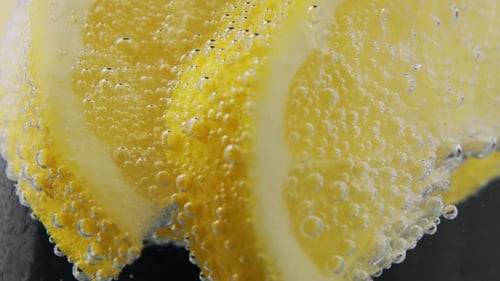 close-up view of Lemon Cocktail on Black Background