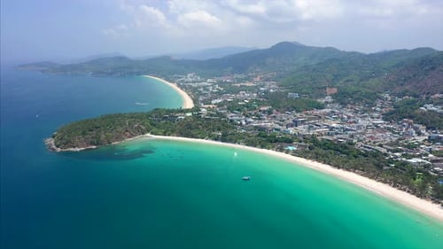 Aerial hyperlapse of the coast of Phuket island in Thailand. Flight over the beaches of Kata Noi, Ka
