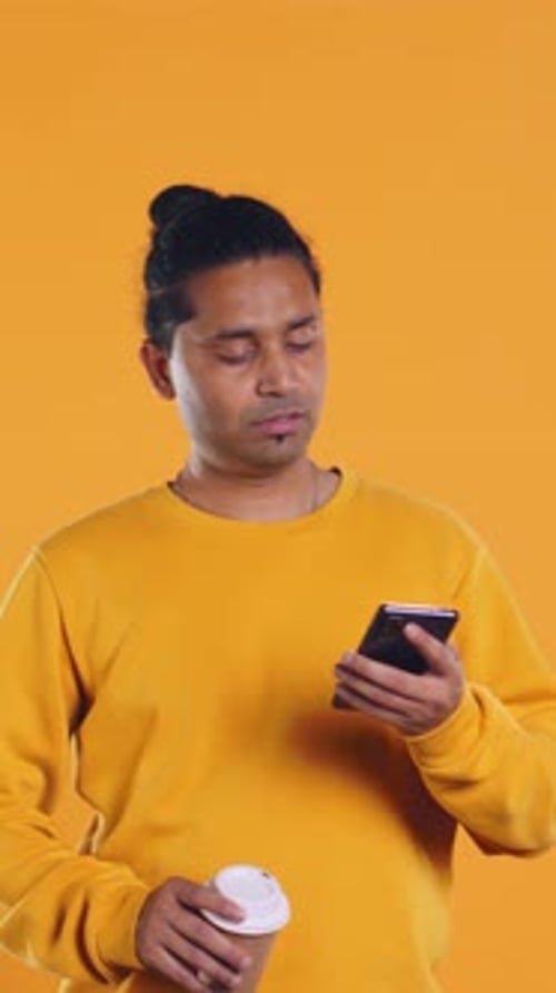 Man Enjoying Fresh Coffee From Disposable Paper Cup Studio Background